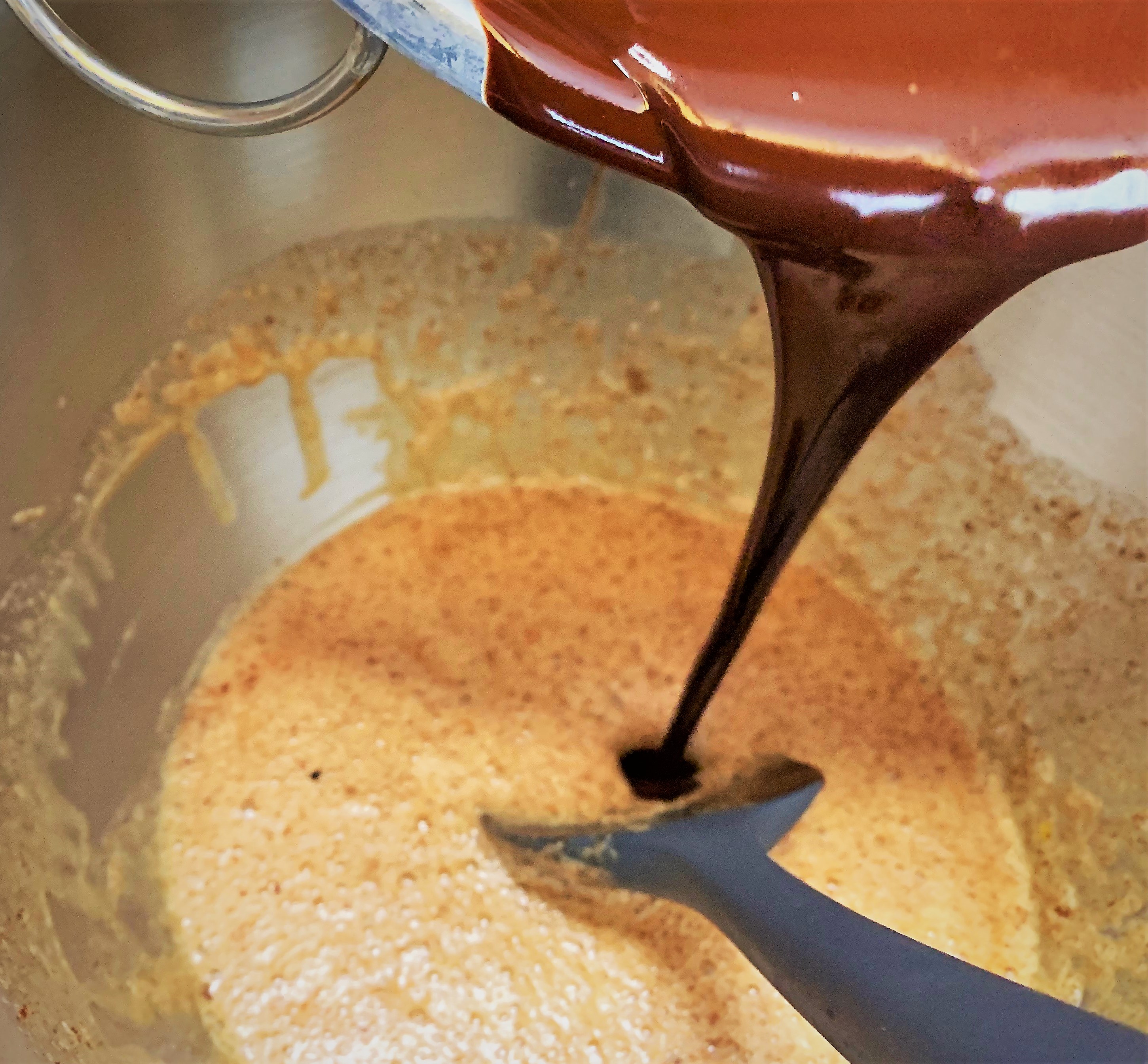 Folding the chocolate into our egg mixture