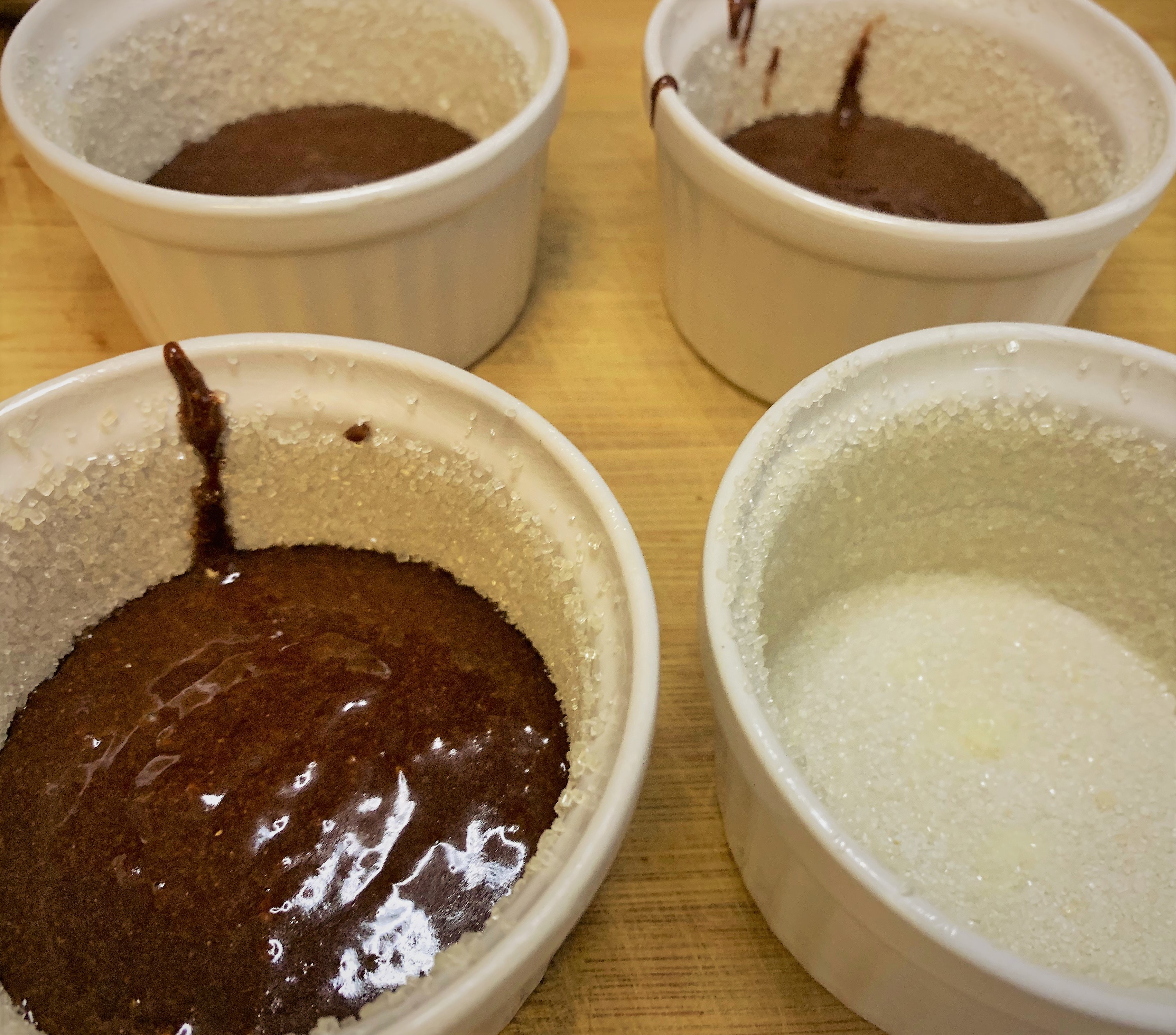 Adding the Molten Chocolate Cake batter to the ramekins