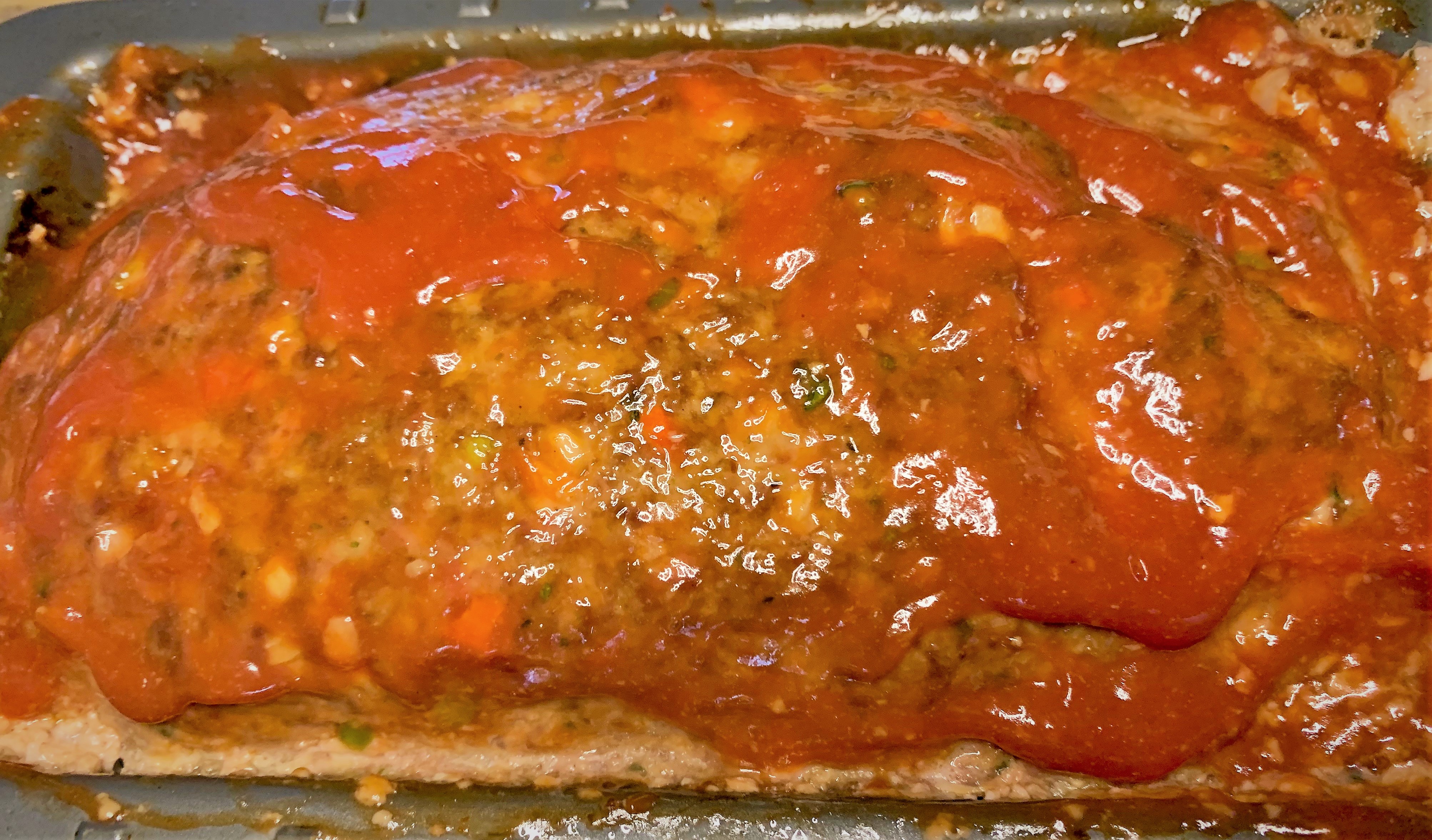 Adding the glaze to our meatloaf