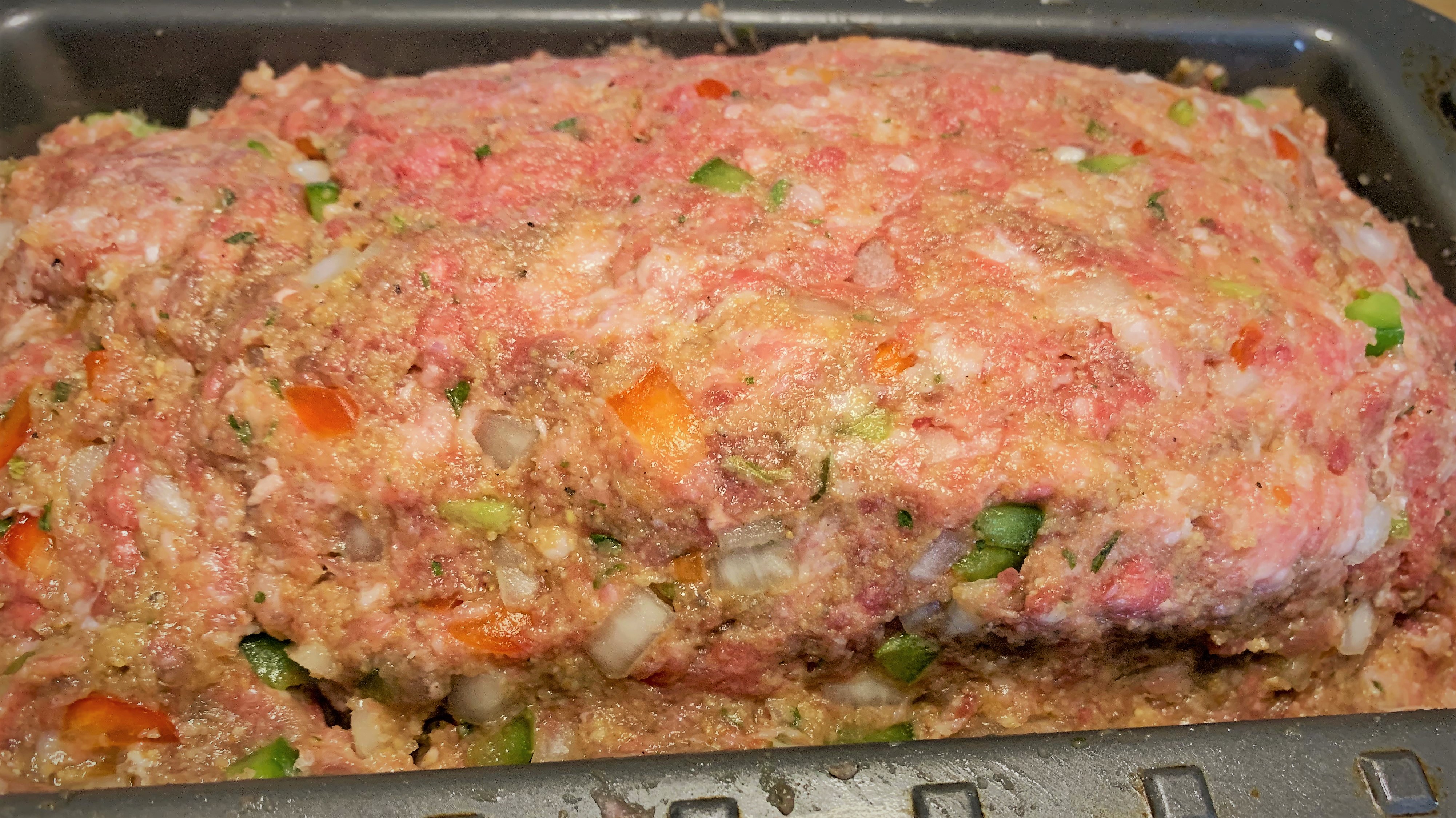 Our loaf pan filled with our meatloaf mux