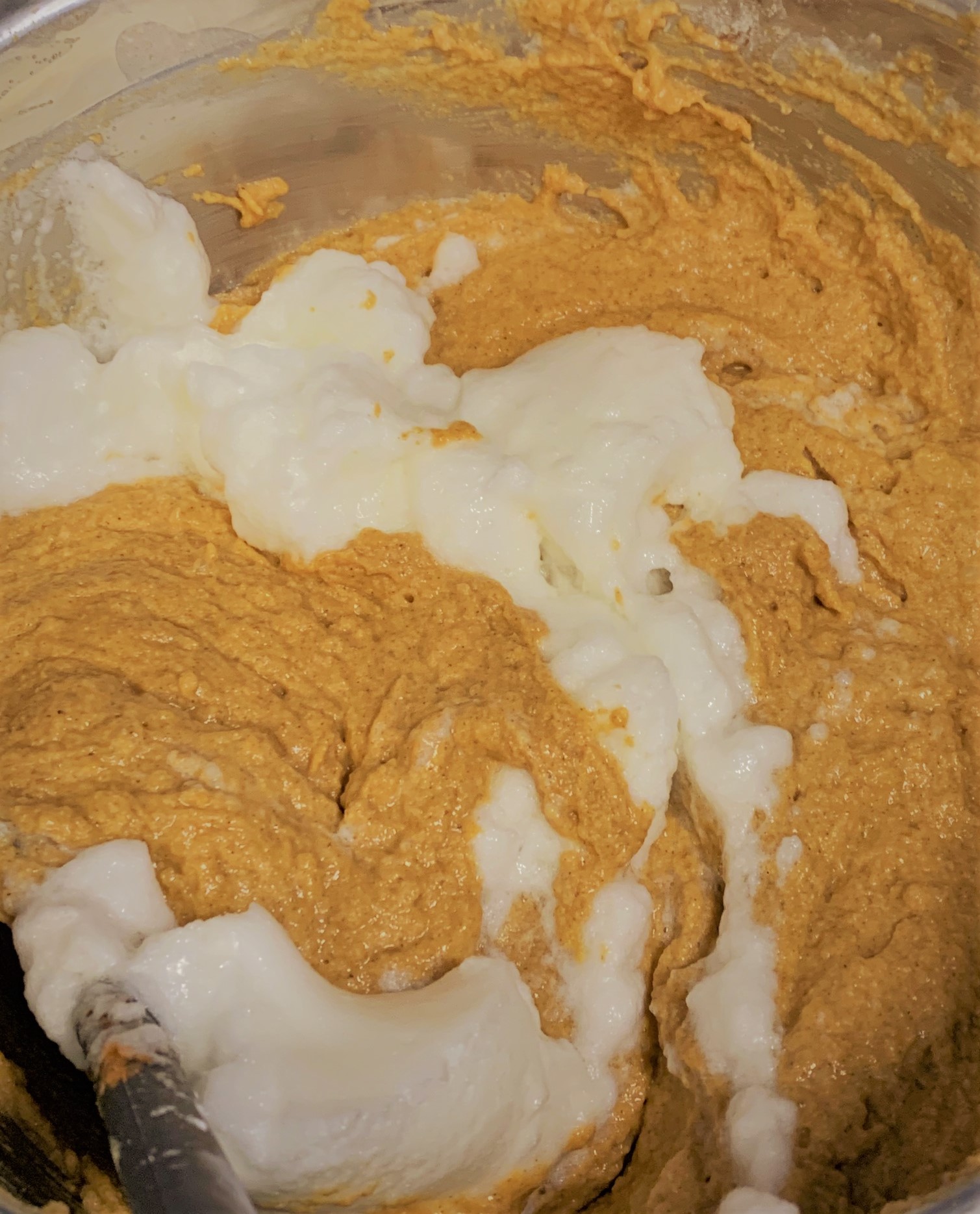 Folding the Whipped Egg Whites into our Pumpkin Mickey Waffles Batter