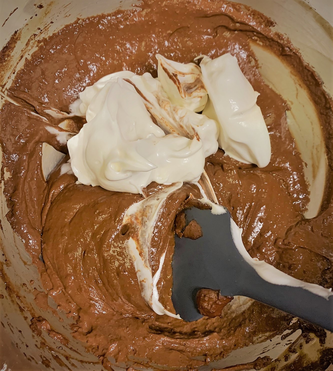 Adding the Whipped Egg Whites to the batter for our Chocolate Souffle Recipe from Palo