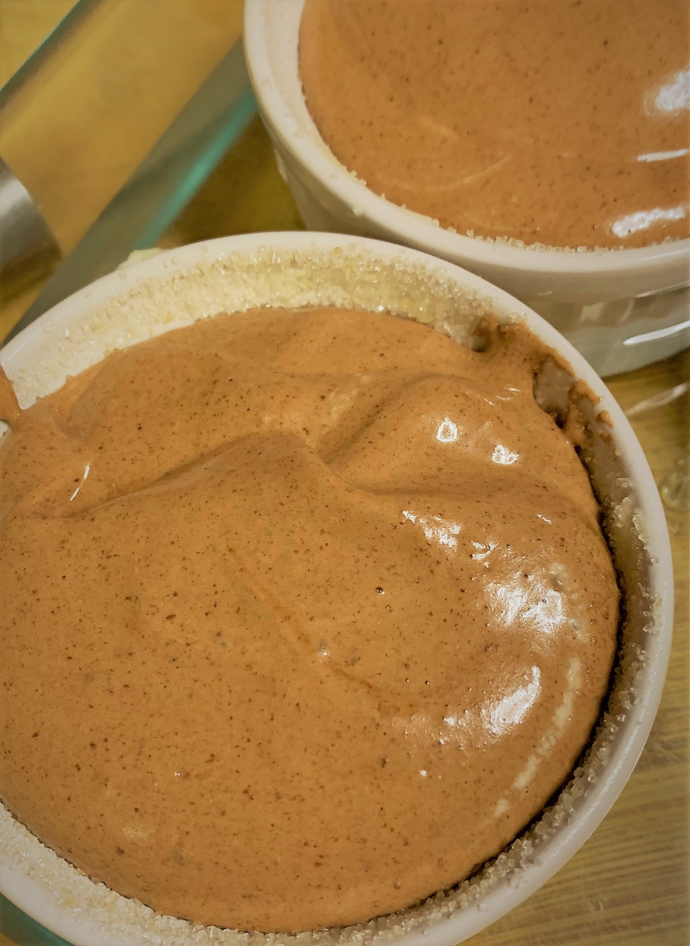 Adding the batter to the souffle cups 