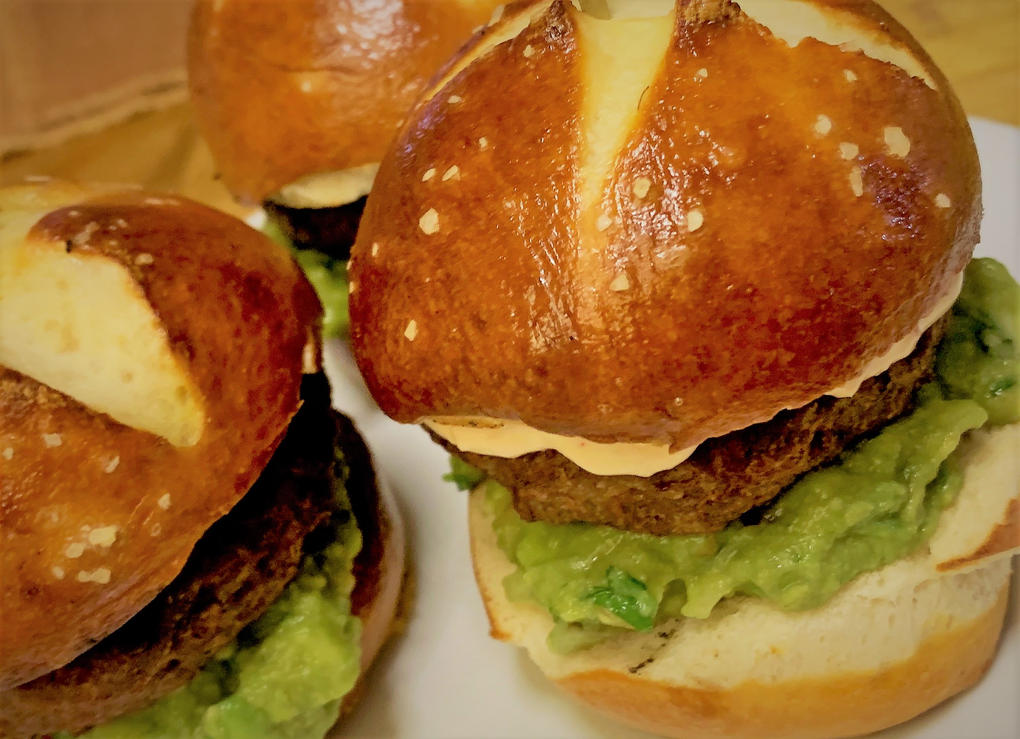 Our Pretzel Slider Rolls used in the Petite Plant Based Burger with Guacamole