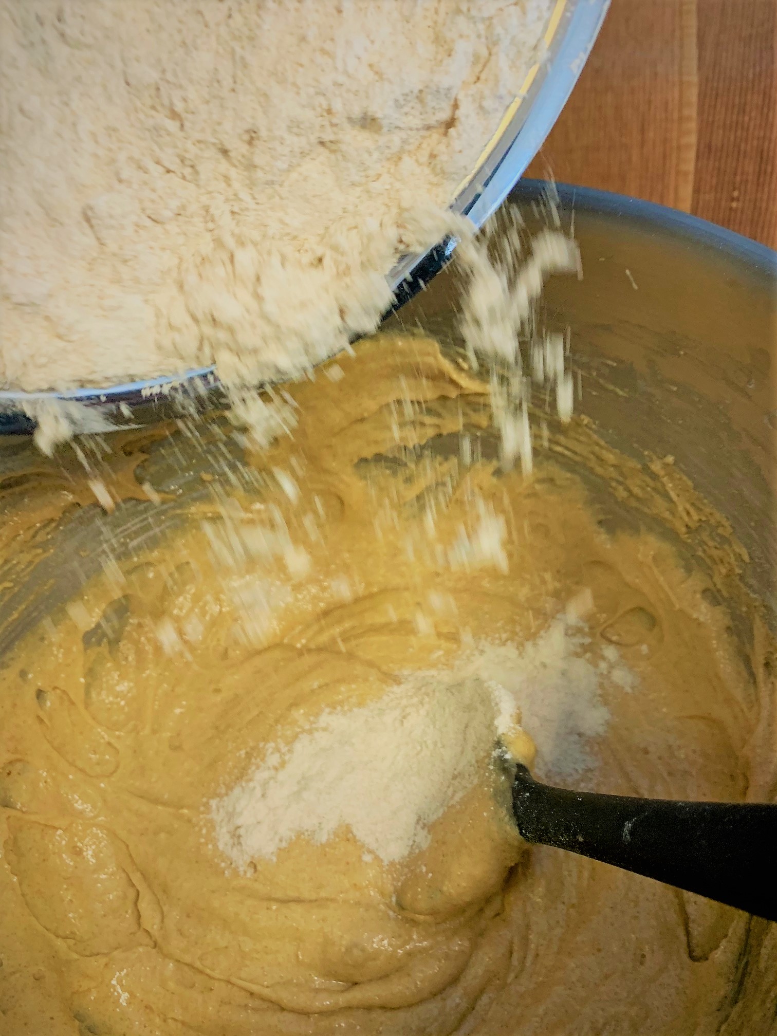 Adding the flour to our batter