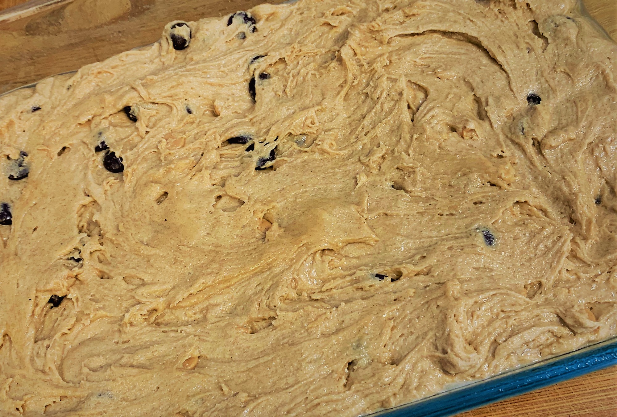 Our Peanut Butter Cup Cake Bar Batter spread within the Baking Dish