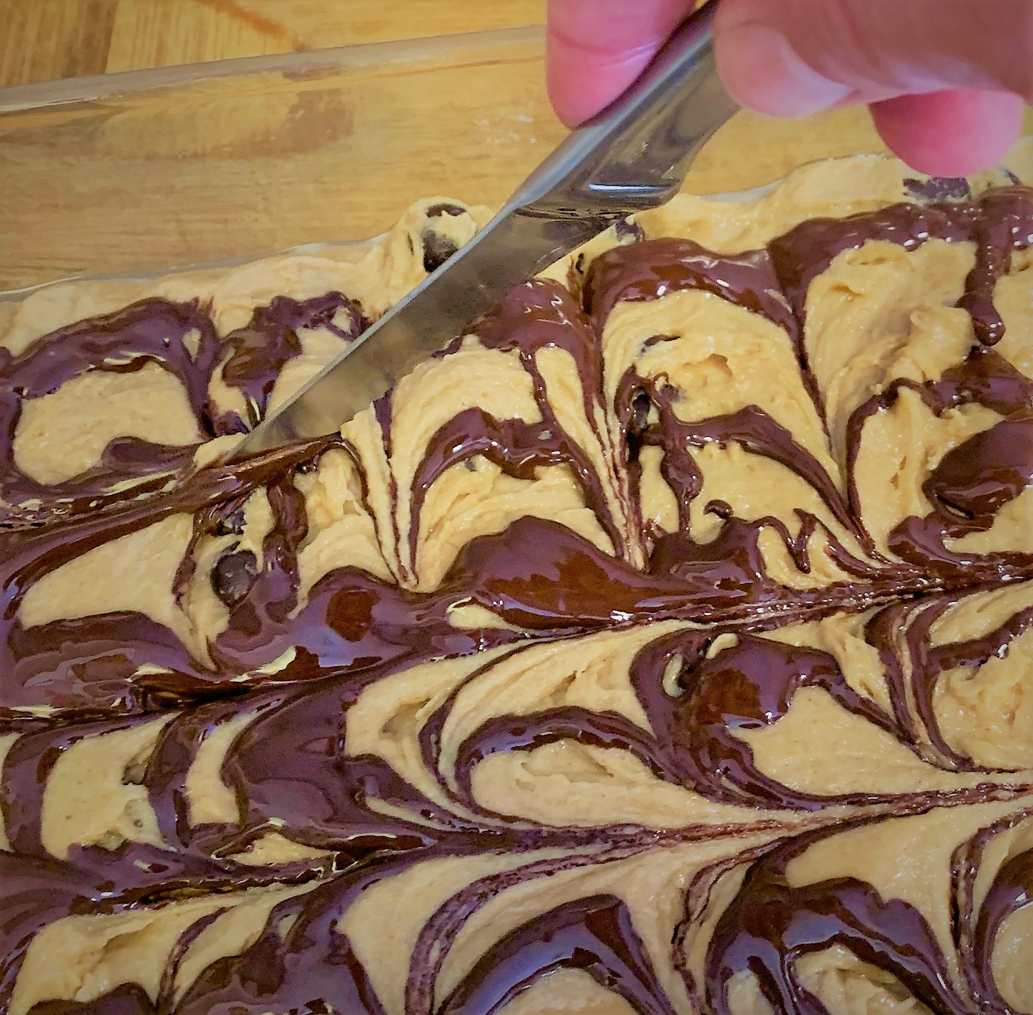 Swirling the Melted Chocolate on top of our Batter