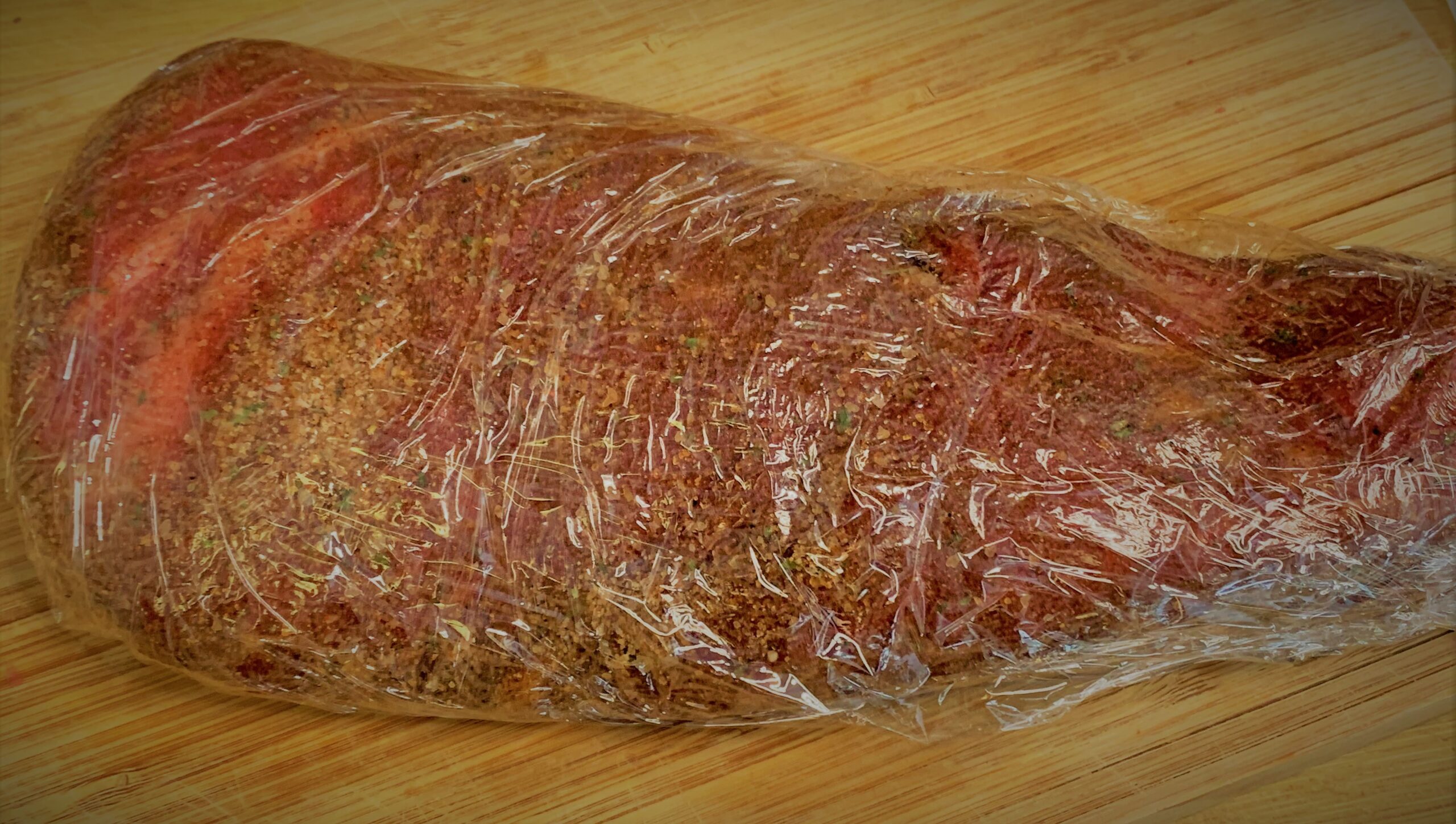 Our rubbed Tri-Tip Wrapped in plastic to marinate