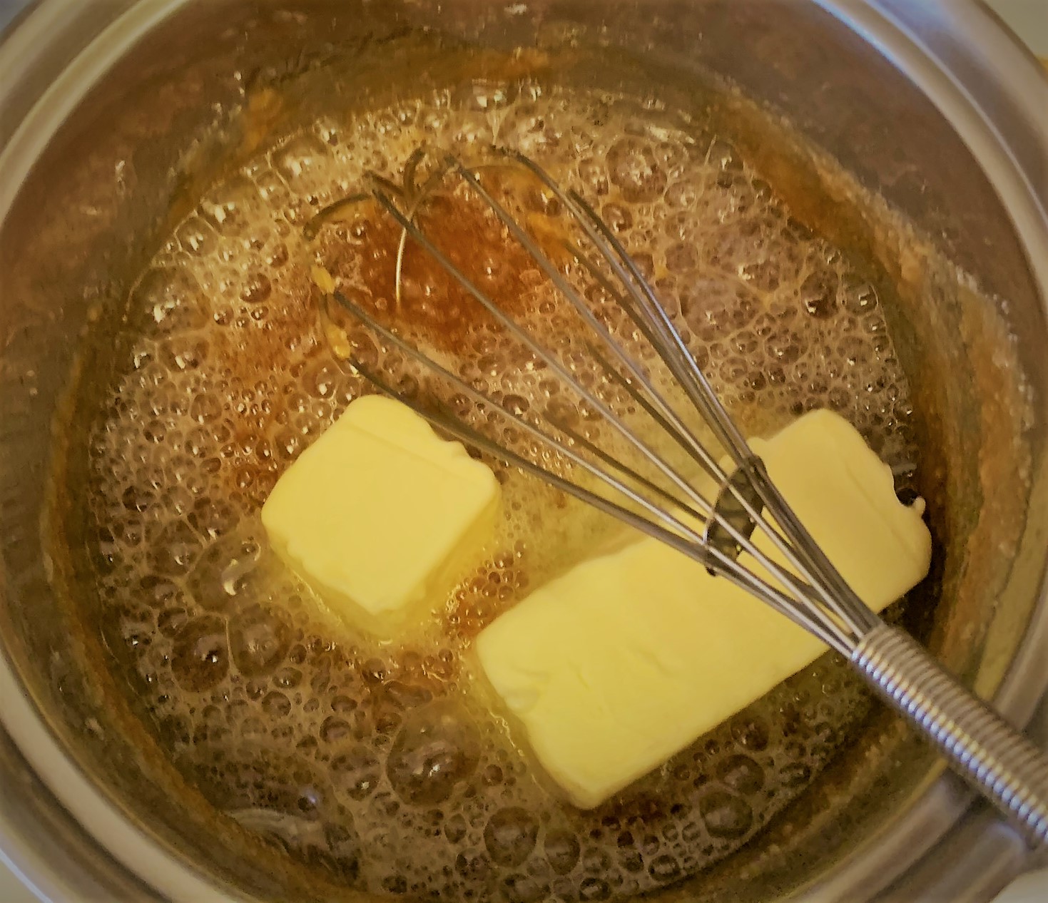 Adding the butter to our Salted Caramel Sauce