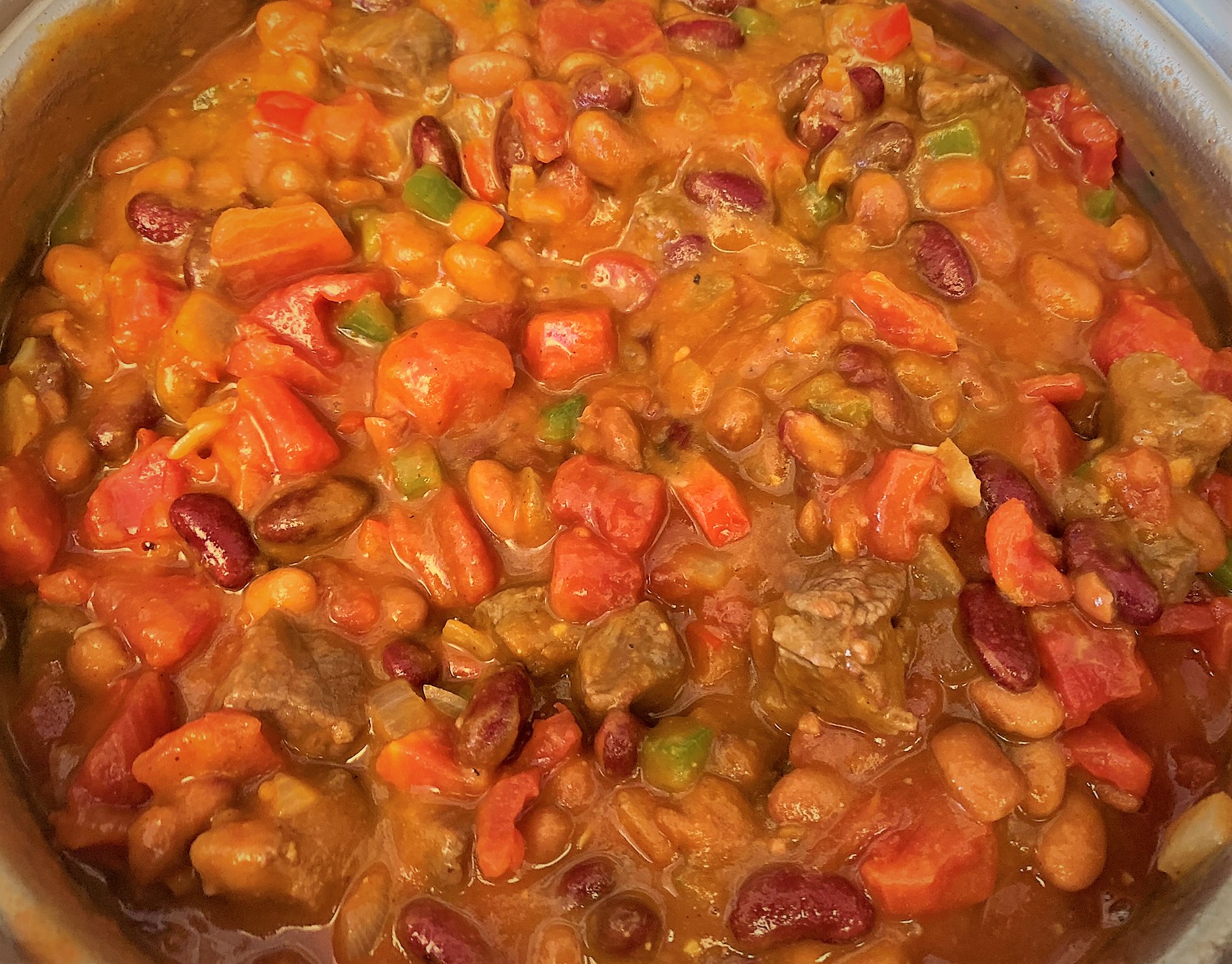 Diced Tomatoes added to the pot for our Pumpkin Chili Recipe