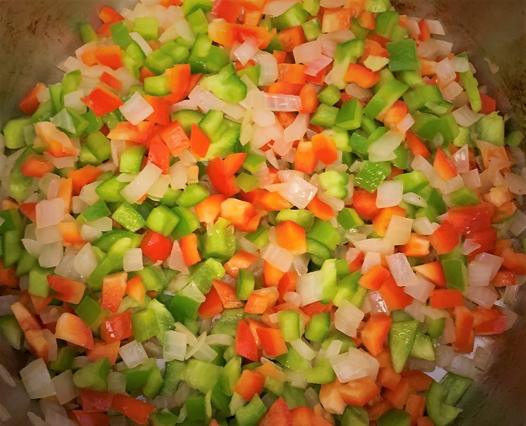 Green and Red Bell Pepper added to the pan