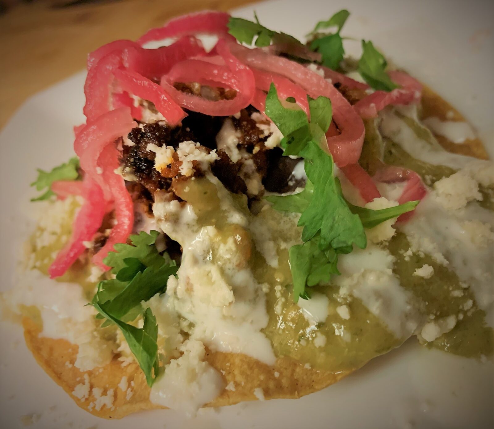 Our plated Tostada de Chorizo from Las Posadas Holiday Kitchen