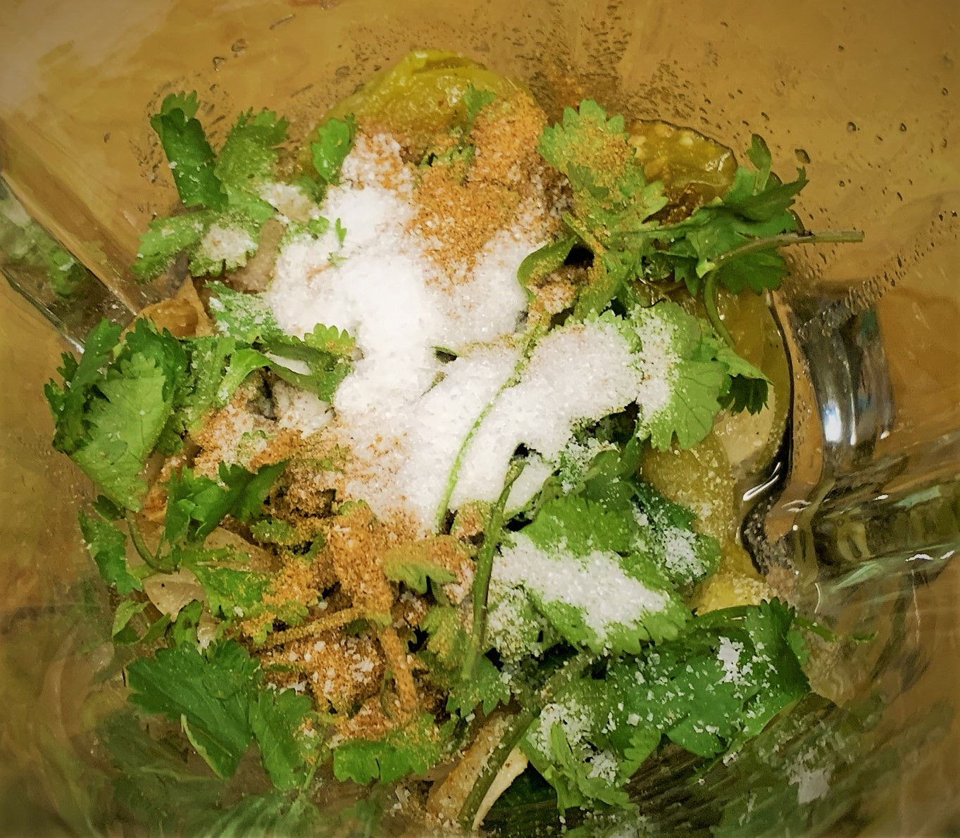 Adding the Cilantro, Cumin and Salt added to our Salsa Verde Ingredients in a blender