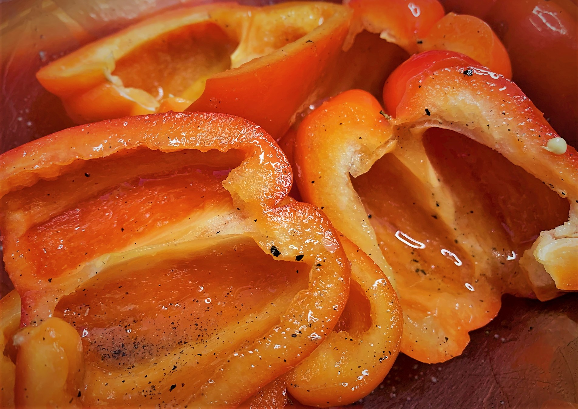 Split Red Bell Peppers with Oil, Salt and Pepper