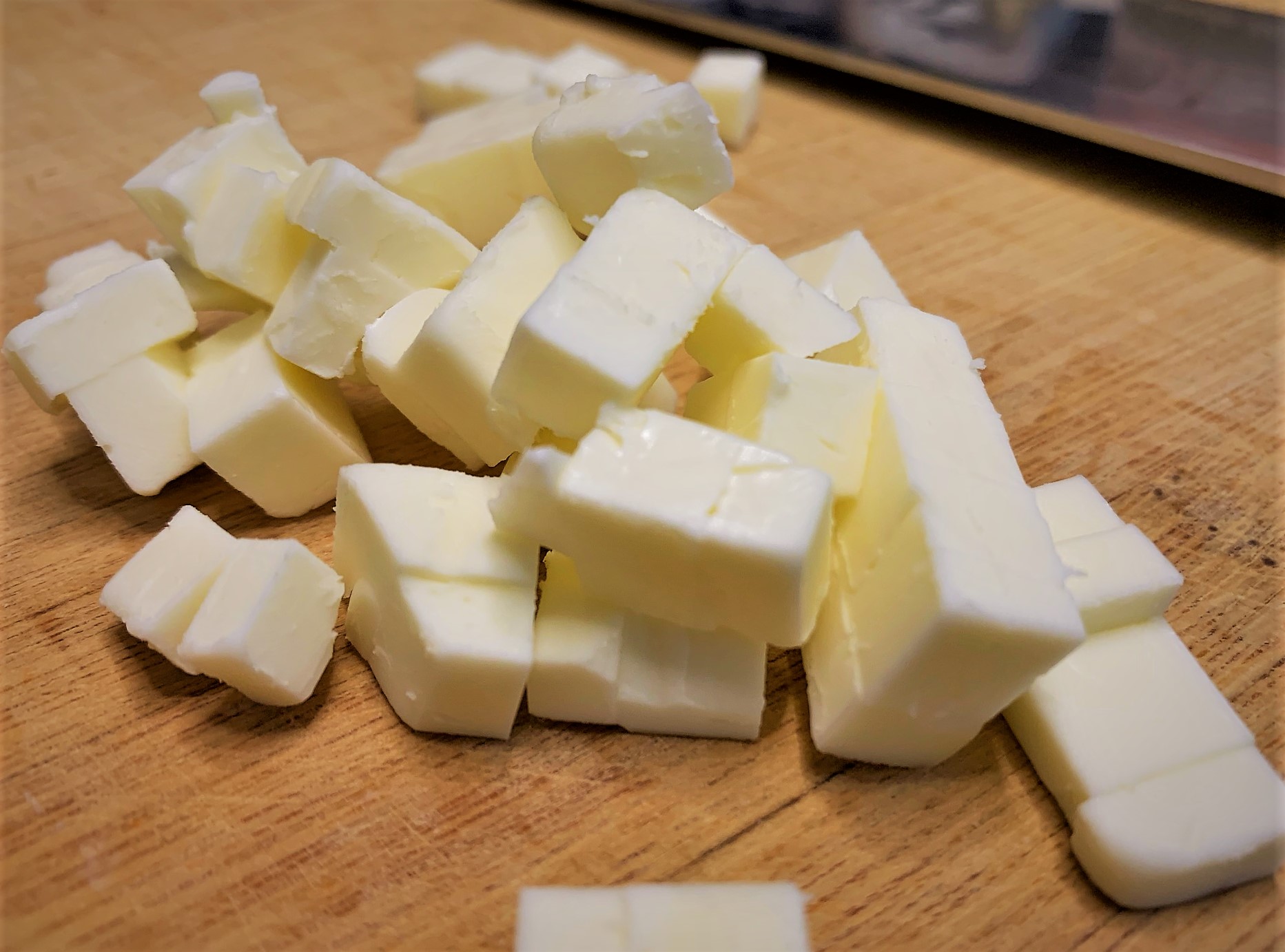 Cubing the Butter for our Potato Cheddar Biscuits with Salmon Tartare