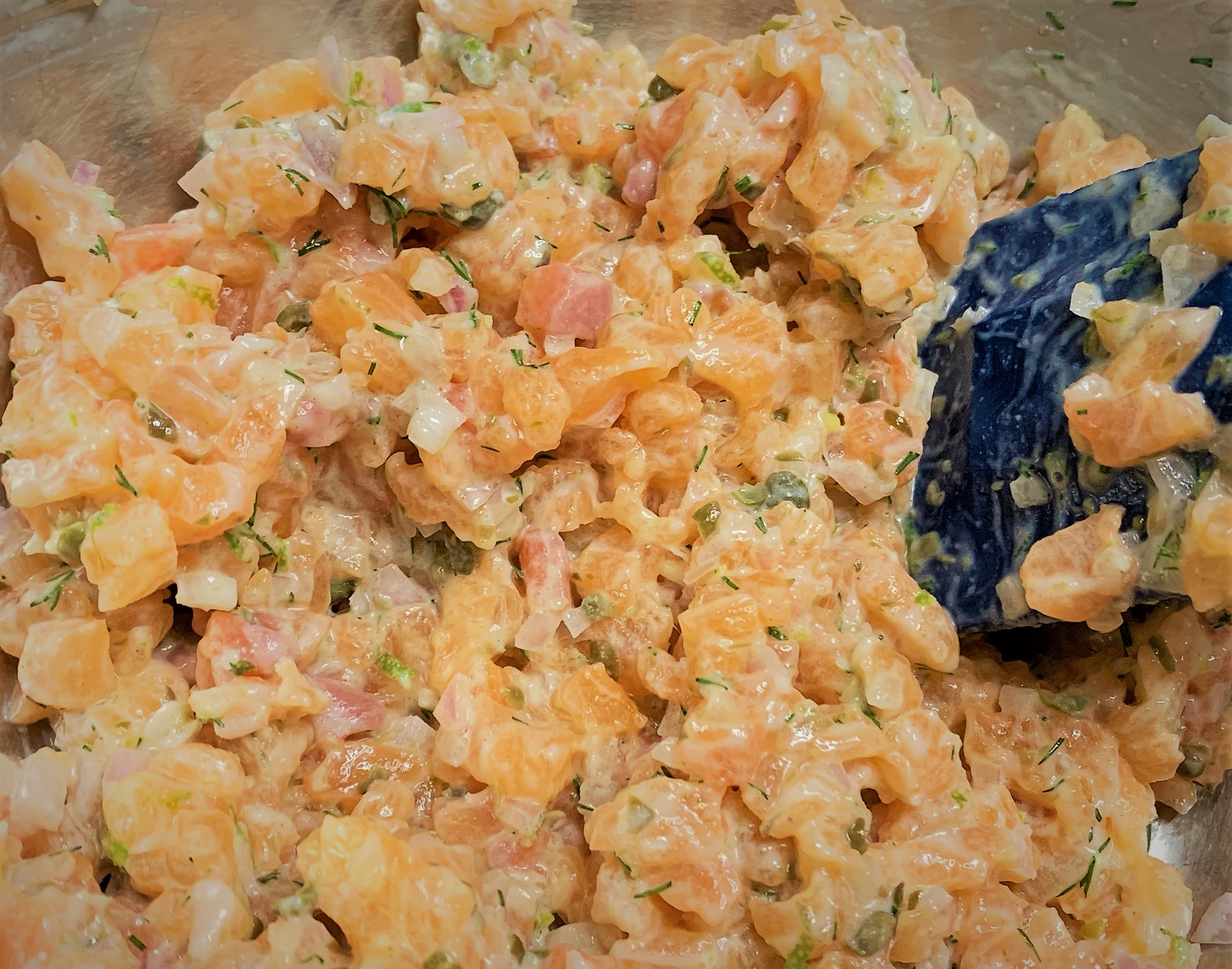 The fully mixed Salmon Tartare - Potato Cheddar Biscuits with Salmon Tartare 