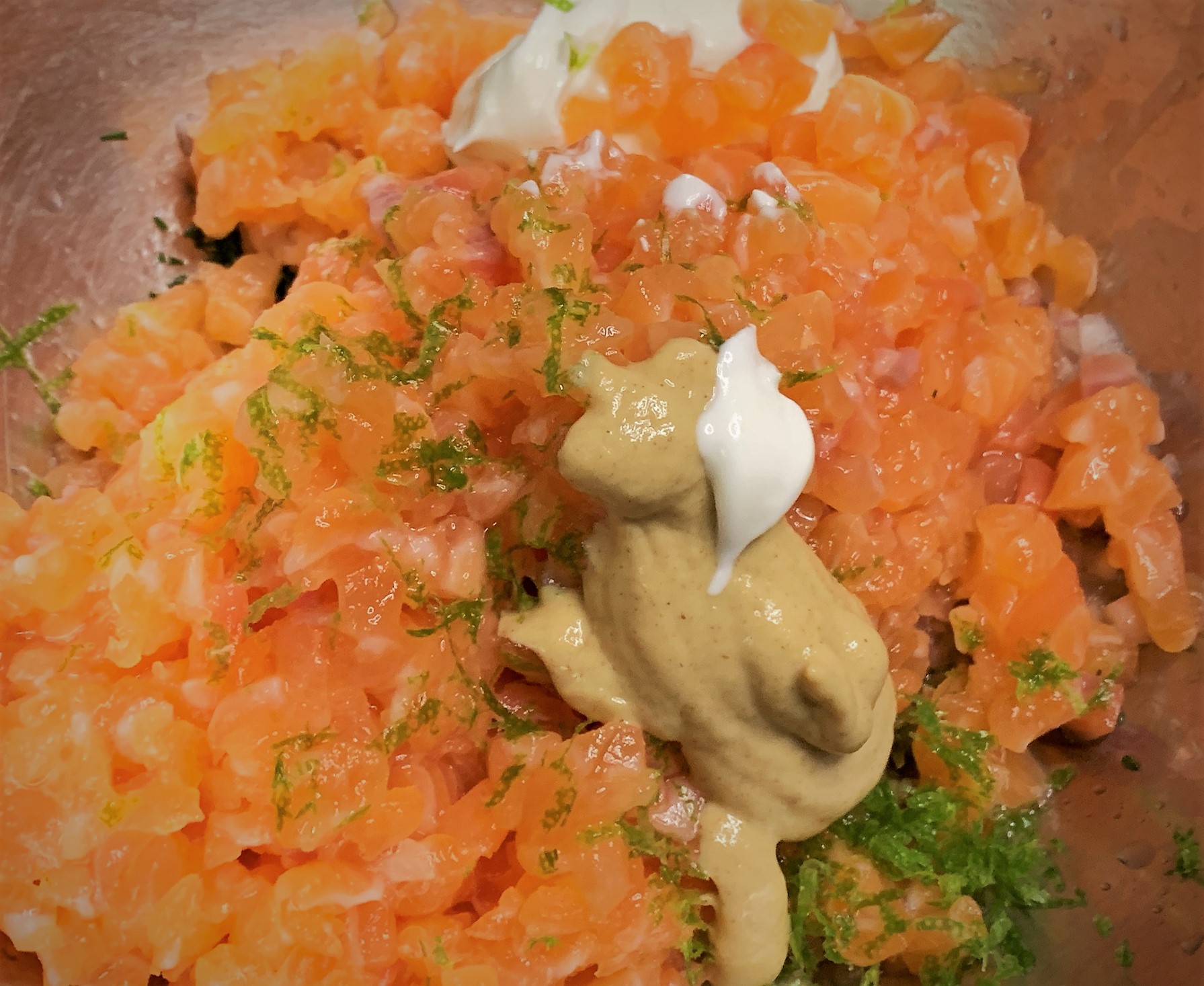 The Salmon Tartare ingredients added to a bowl prior to mixing