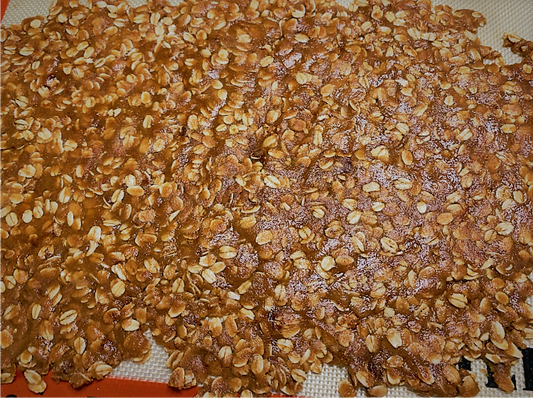 The Oatmeal Streusel Crumble ingredients spread on a baking sheet prior to cooking - Warm Berry Buckle Recipe