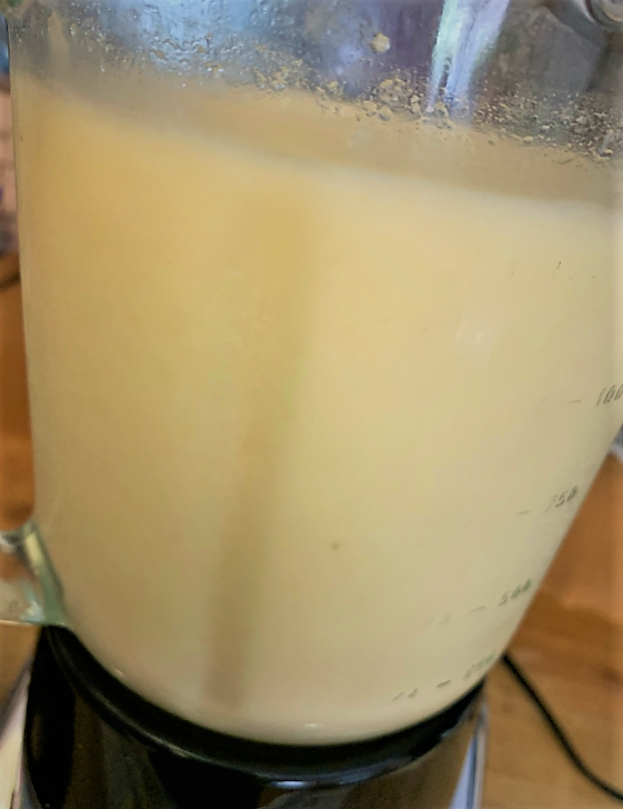 The fully blended Piña Colada portion of our Disney Dishes Piña Colava Recipe added to a blender