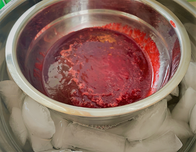 The strained Raspberry Purée cooling in an ice bath