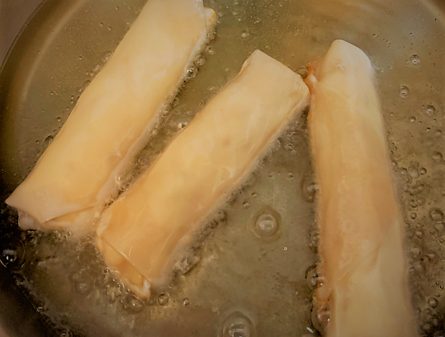 Our Pongu Lumpia in the oil to fry on the first side