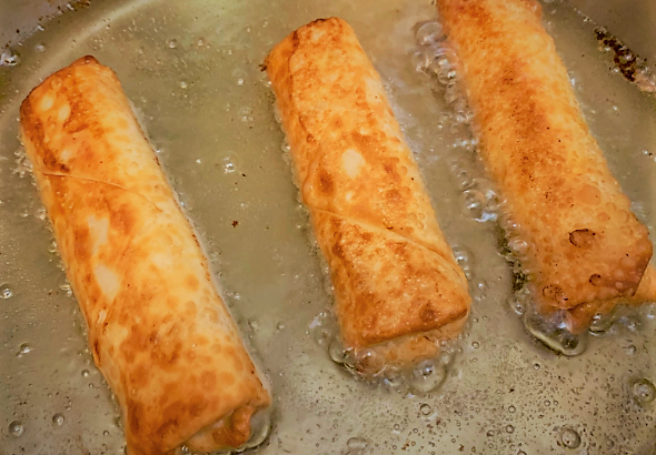 Frying the second side of our Pongu Lumpia