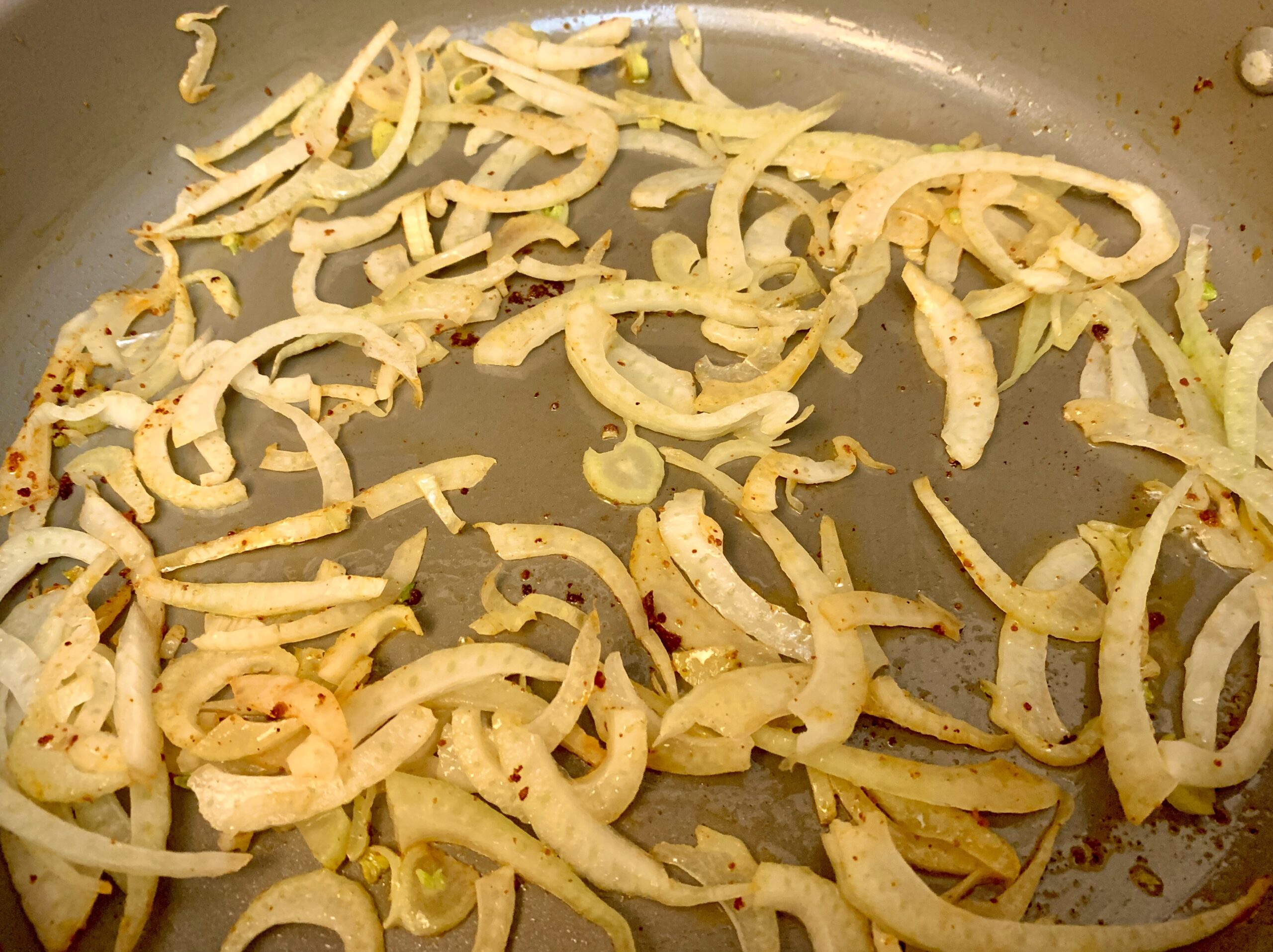 Fennel added to the pan and cooking