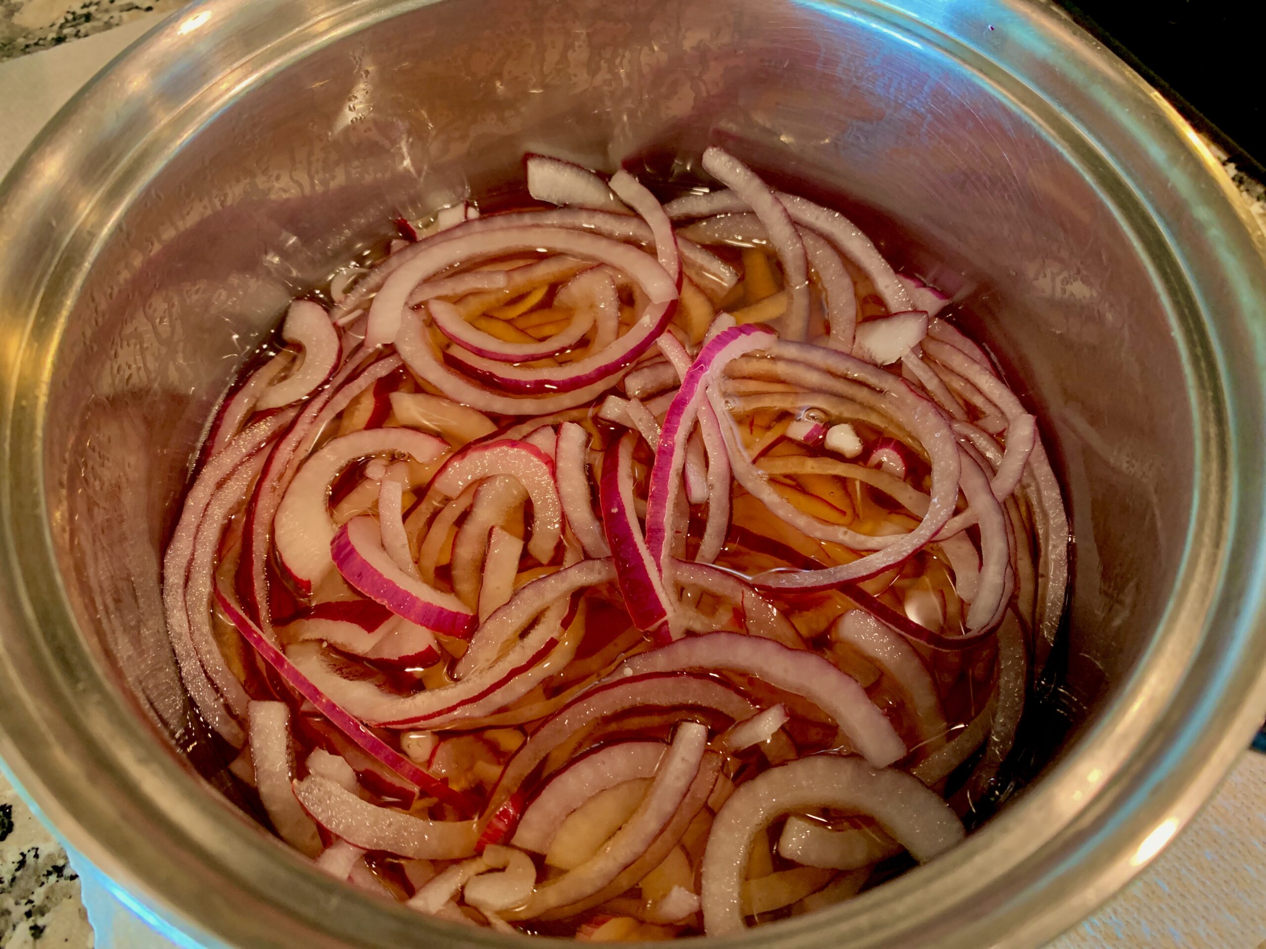 The red onions in our pickling liquid