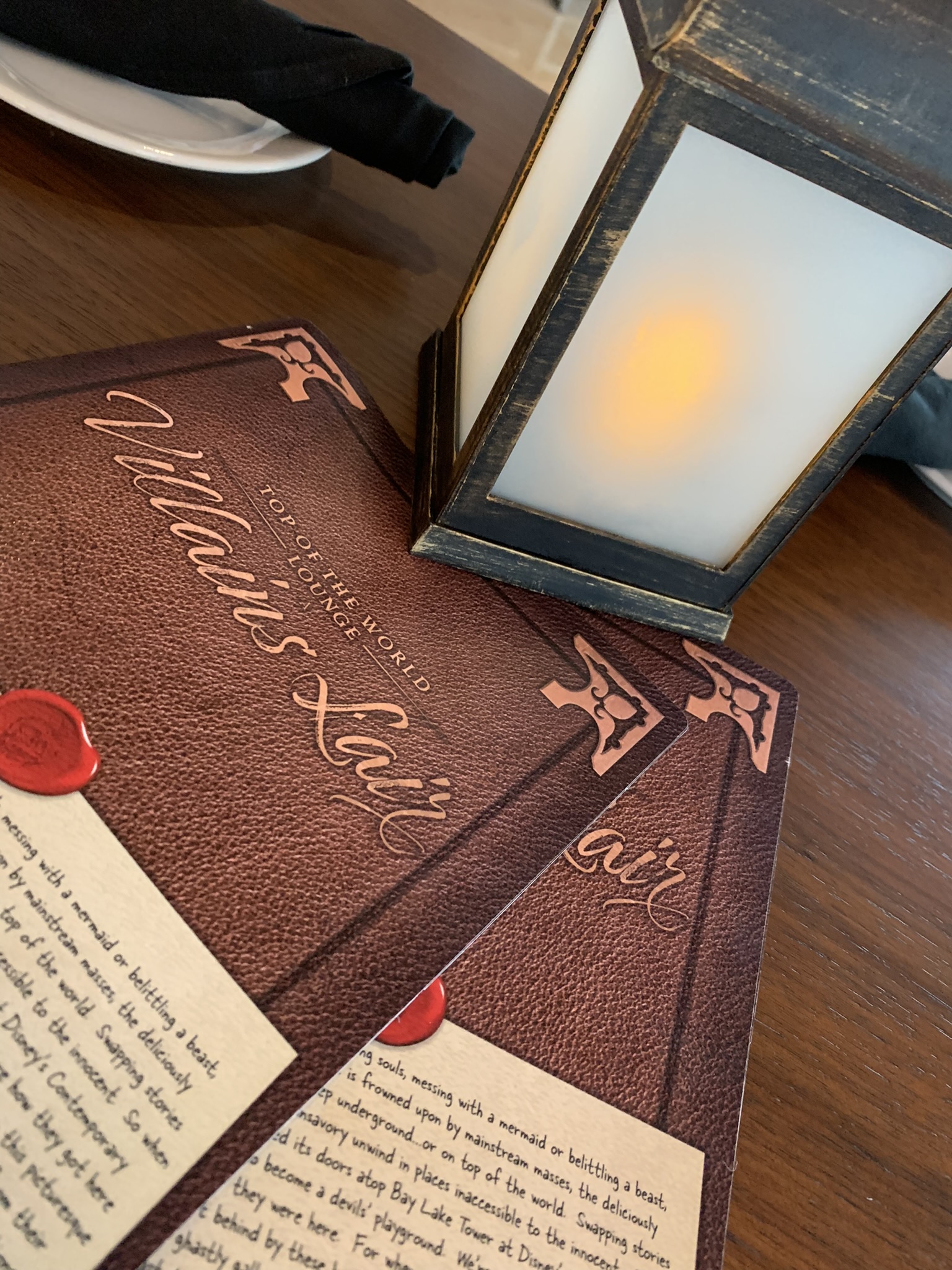 Lamp and menus for Top Of The World Lounge: Villains Lair