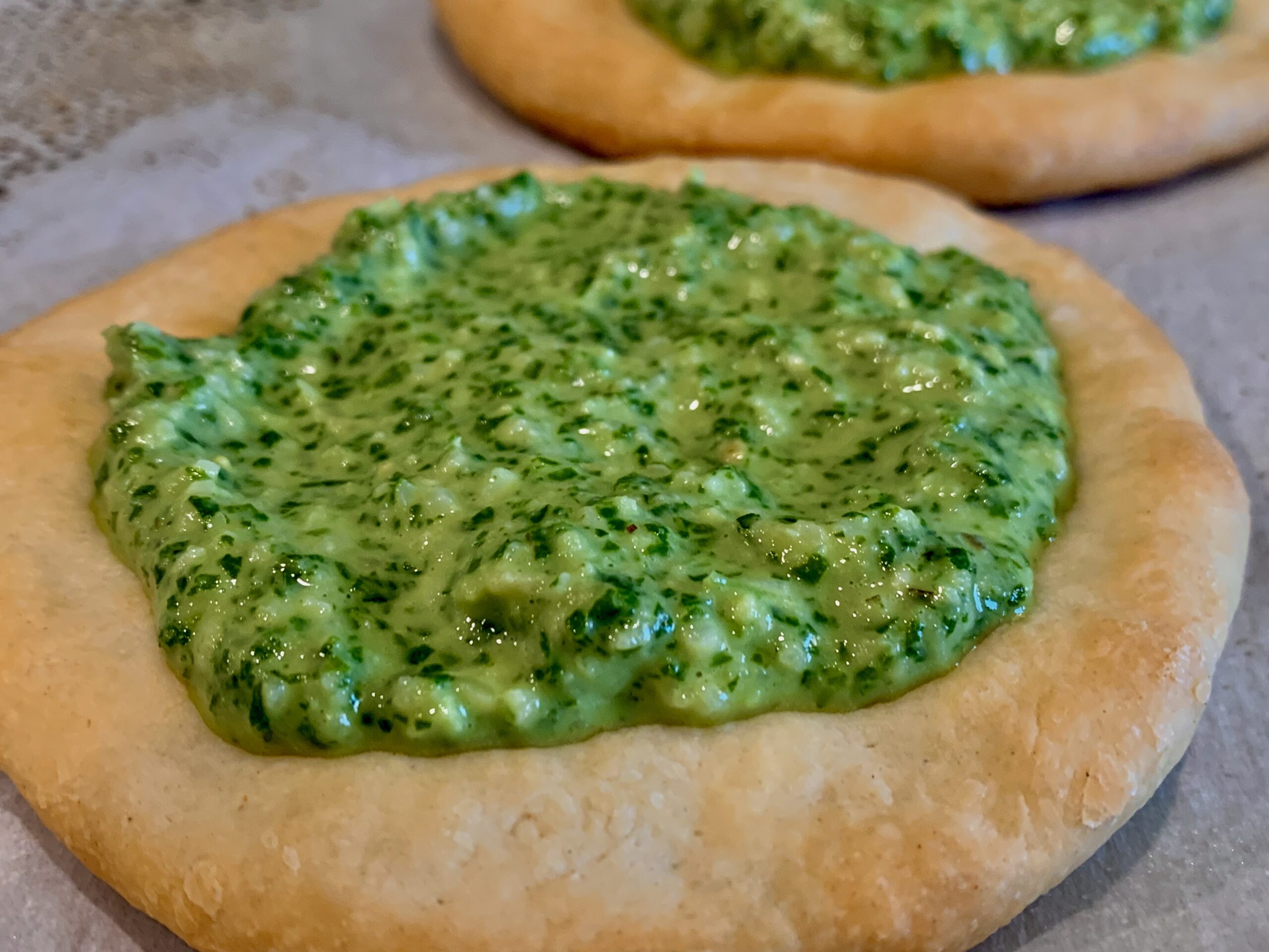 Basil added to the top of our Flatbread Crusts