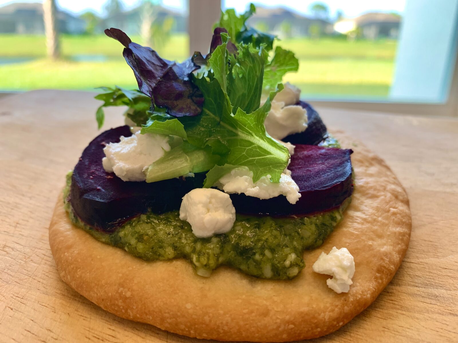 Our completed Roasted Beet & Goat Cheese Flatbread with Basil Pesto